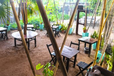 Tropical hotel and resort Blat Ha Blat-ha with palm trees and bamboo on Isla Holbox island in Quintana Roo Mexico.