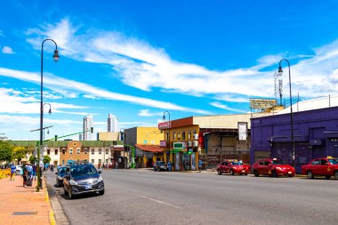 Merced San Jose Costa Rica 08. August 2021 Colorful street with cars stores trade buildings houses architecture and people in Merced San Jose Costa Rica in Central America.