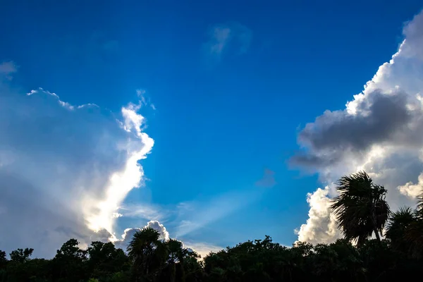 Explosive cloud formation cumulus clouds in the sky in Playa del Carmen Quintana Roo Mexico.