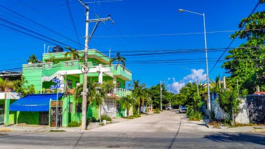 Playa del Carmen 20. July 2021 Typical street road and cityscape with cars traffic restaurants shops stores people and buildings of Playa del Carmen in Quintana Roo Mexico.