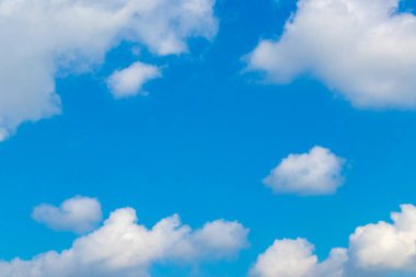 Blue sky with beautiful clouds cloud formations on sunny day in Zicatela Puerto Escondido Oaxaca Mexico.