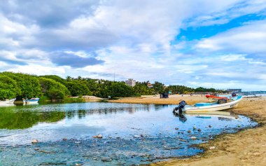 Dirty green polluted and garbage river in Zicatela Puerto Escondido Oaxaca Mexico.