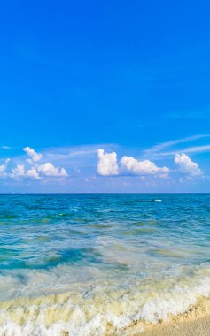 Tropical caribbean beach landscape panorama with clear turquoise blue water in Playa del Carmen Mexico.