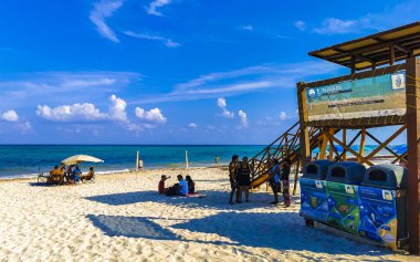 Playa del Carmen 08. May 2021 Tropical mexican beach watch tower landscape panorama full of people at beach parties on vacation in Playa del Carmen Mexico.