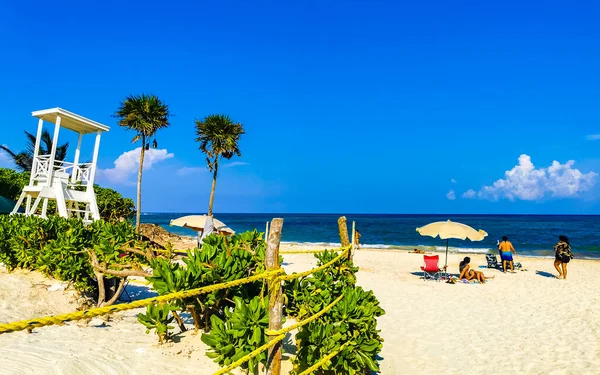Tropical caribbean beach landscape panorama people parties vacation in Playa del Carmen Mexico.