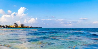 Tropical caribbean beach landscape panorama with clear turquoise blue water in Playa del Carmen Mexico.
