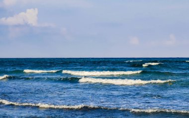 Tropical caribbean beach landscape panorama with clear turquoise blue water in Playa del Carmen Mexico.