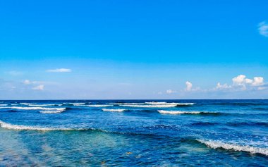 Tropical caribbean beach landscape panorama with clear turquoise blue water in Playa del Carmen Mexico.
