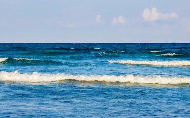 Tropical caribbean beach landscape panorama with clear turquoise blue water in Playa del Carmen Mexico.