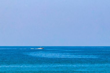 Boat yacht ship ferry jetty pier and harbor at the tropical mexican beach panorama view in Zicatela Puerto Escondido Oaxaca Mexico.