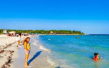 Tropical caribbean beach landscape panorama with clear turquoise blue water in Playa del Carmen Mexico.