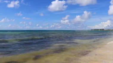 Tropical caribbean beach landscape panorama with clear turquoise blue water in Playa del Carmen Mexico.