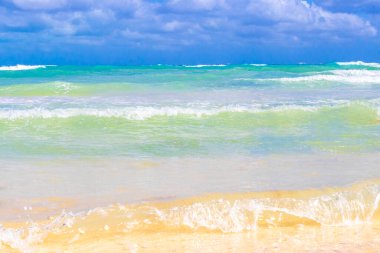 Tropical caribbean beach landscape panorama with clear turquoise blue water in Playa del Carmen Mexico.
