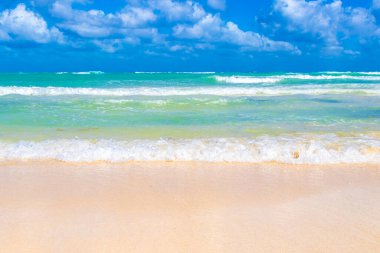 Tropical caribbean beach landscape panorama with clear turquoise blue water in Playa del Carmen Mexico.