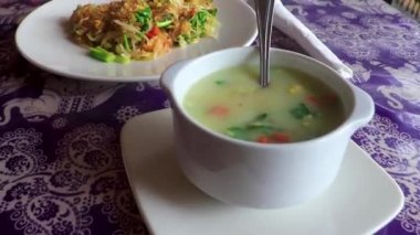 Thai asian soup rice and noodle dish on white plate in Sakhu Thalang on Phuket island Thailand in Southeastasia Asia.