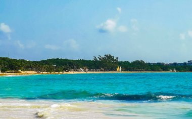 Tropical caribbean beach landscape panorama with clear turquoise blue water in Playa del Carmen Mexico.