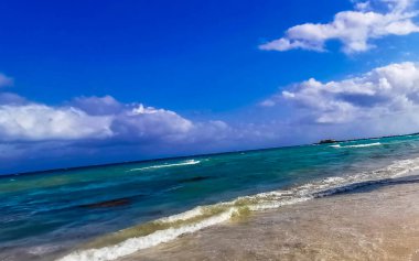Tropical caribbean beach landscape panorama with clear turquoise blue water in Playa del Carmen Mexico.