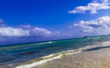 Tropical caribbean beach landscape panorama with clear turquoise blue water in Playa del Carmen Mexico.