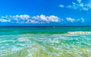 Tropical caribbean beach landscape panorama with clear turquoise blue water in Playa del Carmen Mexico.
