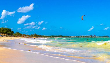 Tropical caribbean beach landscape panorama with clear turquoise blue water in Playa del Carmen Mexico.