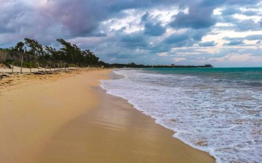 Tropical caribbean beach landscape panorama with clear turquoise blue water in Playa del Carmen Mexico.