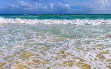Tropical caribbean beach landscape panorama with clear turquoise blue water in Playa del Carmen Mexico.