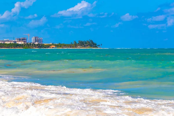 Tropical caribbean beach landscape panorama with clear turquoise blue water in Playa del Carmen Mexico.