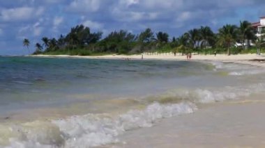 Tropical caribbean beach landscape panorama with clear turquoise blue water in Playa del Carmen Mexico.
