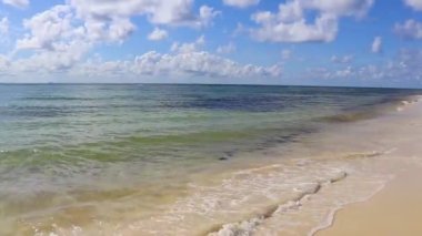 Tropical caribbean beach landscape panorama with clear turquoise blue water in Playa del Carmen Mexico.