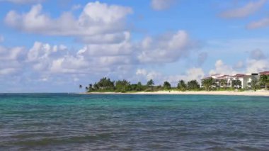 Tropical caribbean beach landscape panorama with clear turquoise blue water in Playa del Carmen Mexico.