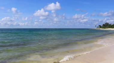 Tropical caribbean beach landscape panorama with clear turquoise blue water in Playa del Carmen Mexico.
