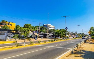 Puerto Escondido Oaxaca Mexico 2022 Busy road street driving cars traffic jam and places in Zicatela Puerto Escondido Oaxaca Mexico.