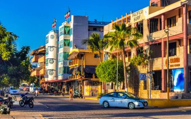 Puerto Escondido Oaxaca Mexico 2022 Beautiful scenic view panorama of the city and tourist street road with buildings hotels palm trees people and shops stores Puerto Escondido and Zicatela Oaxaca Mexico.