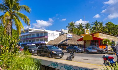 Puerto Escondido Oaxaca Mexico 2022 Beautiful scenic view panorama of the city and tourist street road with buildings hotels palm trees people and shops stores Puerto Escondido and Zicatela Oaxaca Mexico.