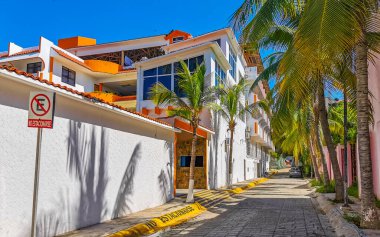 Puerto Escondido Oaxaca Mexico 2022 Beautiful scenic view panorama of the city and tourist street road with buildings hotels palm trees people and shops stores Puerto Escondido and Zicatela Oaxaca Mexico.