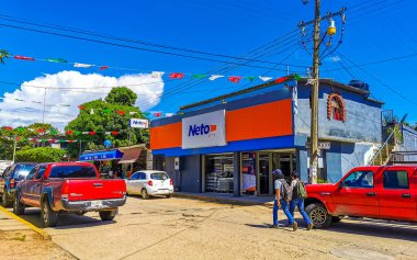 Puerto Escondido Oaxaca Mexico 2022 Busy road street driving cars traffic jam and places in Zicatela Puerto Escondido Oaxaca Mexico.