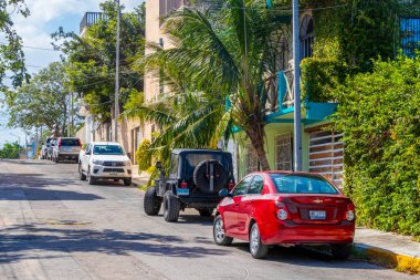 Playa del Carmen Quintana Roo Mexico 2021 Typical street road and cityscape with cars traffic restaurants shops stores people and buildings of Playa del Carmen in Quintana Roo Mexico.