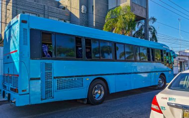 Playa del Carmen Quintana Roo Mexico 2021 Typical street road and cityscape with cars traffic restaurants shops stores people and buildings of Playa del Carmen in Quintana Roo Mexico.