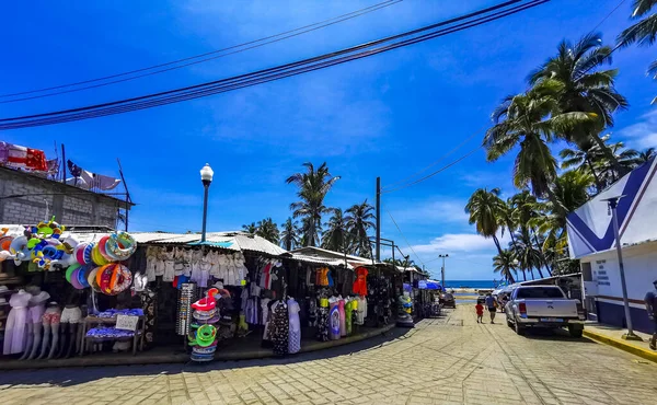 Puerto Escondido Oaxaca Mexico 2022 Busy road street driving cars traffic jam and places in Zicatela Puerto Escondido Oaxaca Mexico.
