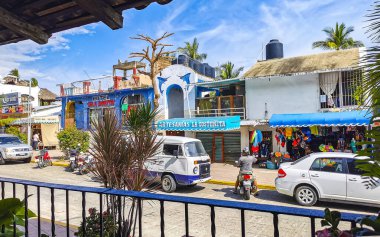 Puerto Escondido Oaxaca Mexico 2022 Beautiful scenic view panorama of the city and tourist street road with buildings hotels palm trees people and shops stores Puerto Escondido and Zicatela Oaxaca Mexico.