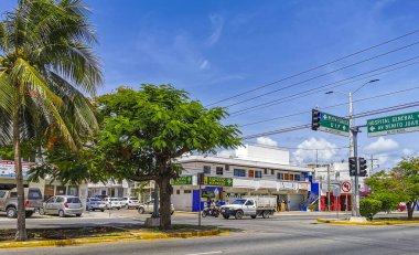 Playa del Carmen Quintana Roo Mexico 2021 Typical street road and cityscape with cars traffic restaurants shops stores people and buildings of Playa del Carmen in Quintana Roo Mexico.
