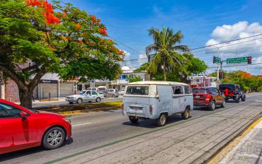 Playa del Carmen Quintana Roo Mexico 2021 Typical street road and cityscape with cars traffic restaurants shops stores people and buildings of Playa del Carmen in Quintana Roo Mexico.