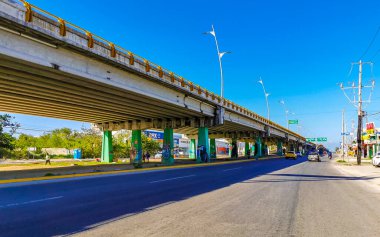 Playa del Carmen Mexico 27. March 2021 Typical Highway Freeway bridge and street road and cityscape with cars buildings of Playa del Carmen in Mexico.
