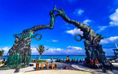 Playa del Carmen Quintana Roo Mexico 17. April 2021 The ancient architecture of the Portal Maya in the Fundadores park with blue sky and turquoise seascape and beach panorama in Playa del Carmen Quintana Roo Mexico.