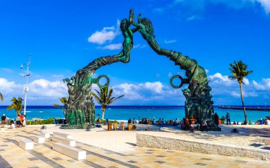 Playa del Carmen Quintana Roo Mexico 17. April 2021 The ancient architecture of the Portal Maya in the Fundadores park with blue sky and turquoise seascape and beach panorama in Playa del Carmen Quintana Roo Mexico.