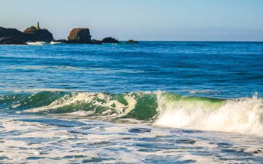 Extremely huge big surfer waves on the beach at La Punta de Zicatela Puerto Escondido Oaxaca Mexico.