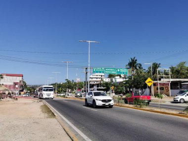 Puerto Escondido Oaxaca Mexico 2022 Busy road street driving cars traffic jam and places in Zicatela Puerto Escondido Oaxaca Mexico.