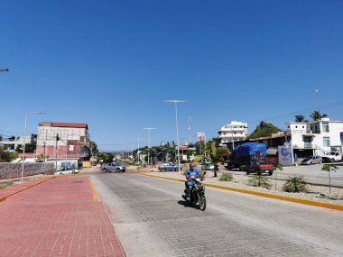 Puerto Escondido Oaxaca Mexico 2022 Busy road street driving cars traffic jam and places in Zicatela Puerto Escondido Oaxaca Mexico.