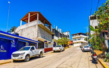Puerto Escondido Oaxaca Mexico 2022 Busy road street driving cars traffic jam and places in Zicatela Puerto Escondido Oaxaca Mexico.