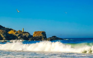 Extremely huge big surfer waves on the beach at La Punta de Zicatela Puerto Escondido Oaxaca Mexico.